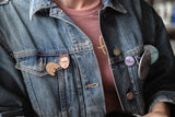 Hannah Gadsby Enamel Face Pin set on denim jacket 